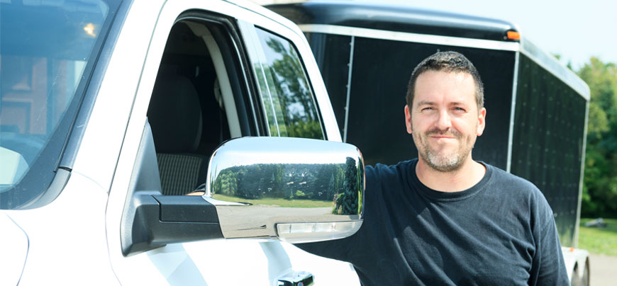 Man with his truck and trailer