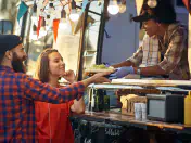 Food truck serves meal to two patrons